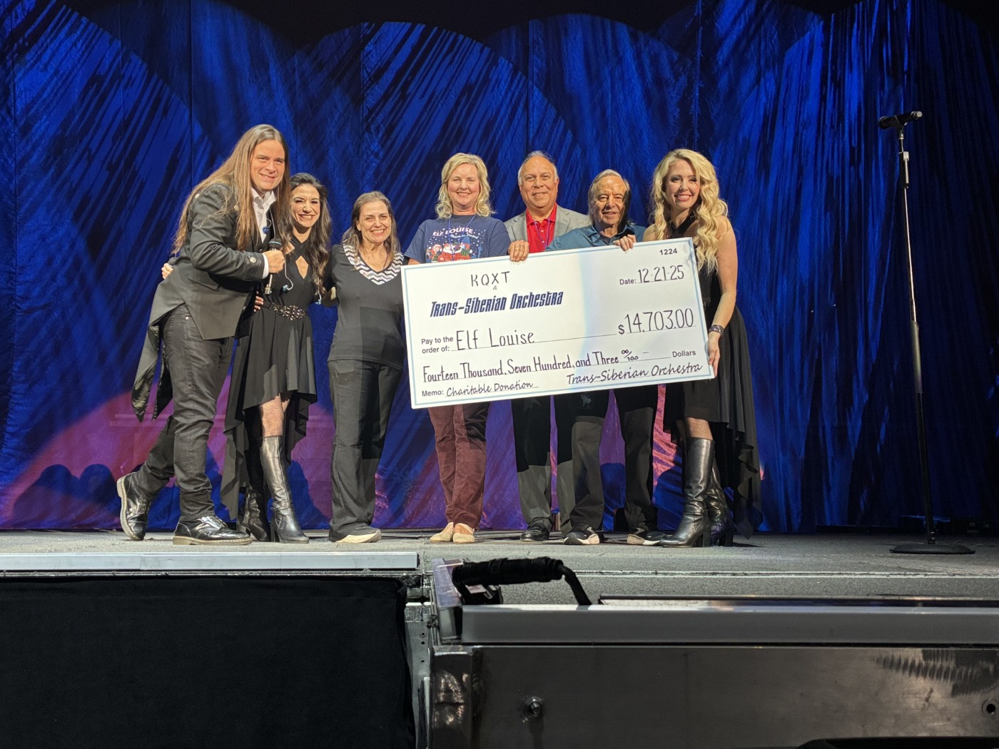 TSO 2025 Matinee Performance onstage photo (L-R) Andrew Ross (TSO), Asha Mevlana (TSO), Jennie James (KQXT-FM), Karin Johnson (President of the Board, Elf Louise), David Munoz (KQXT-FM), Jack Orbin (President Stone City Attractions) and Chloe Lowery (TSO) TSO 2025 Matinee Performance onstage photo (L-R) Andrew Ross (TSO), Asha Mevlana (TSO), Jennie James (KQXT-FM), Karin Johnson (President of the Board, Elf Louise), David Munoz (KQXT-FM), Jack Orbin (President Stone City Attractions) and Chloe Lowery (TSO)